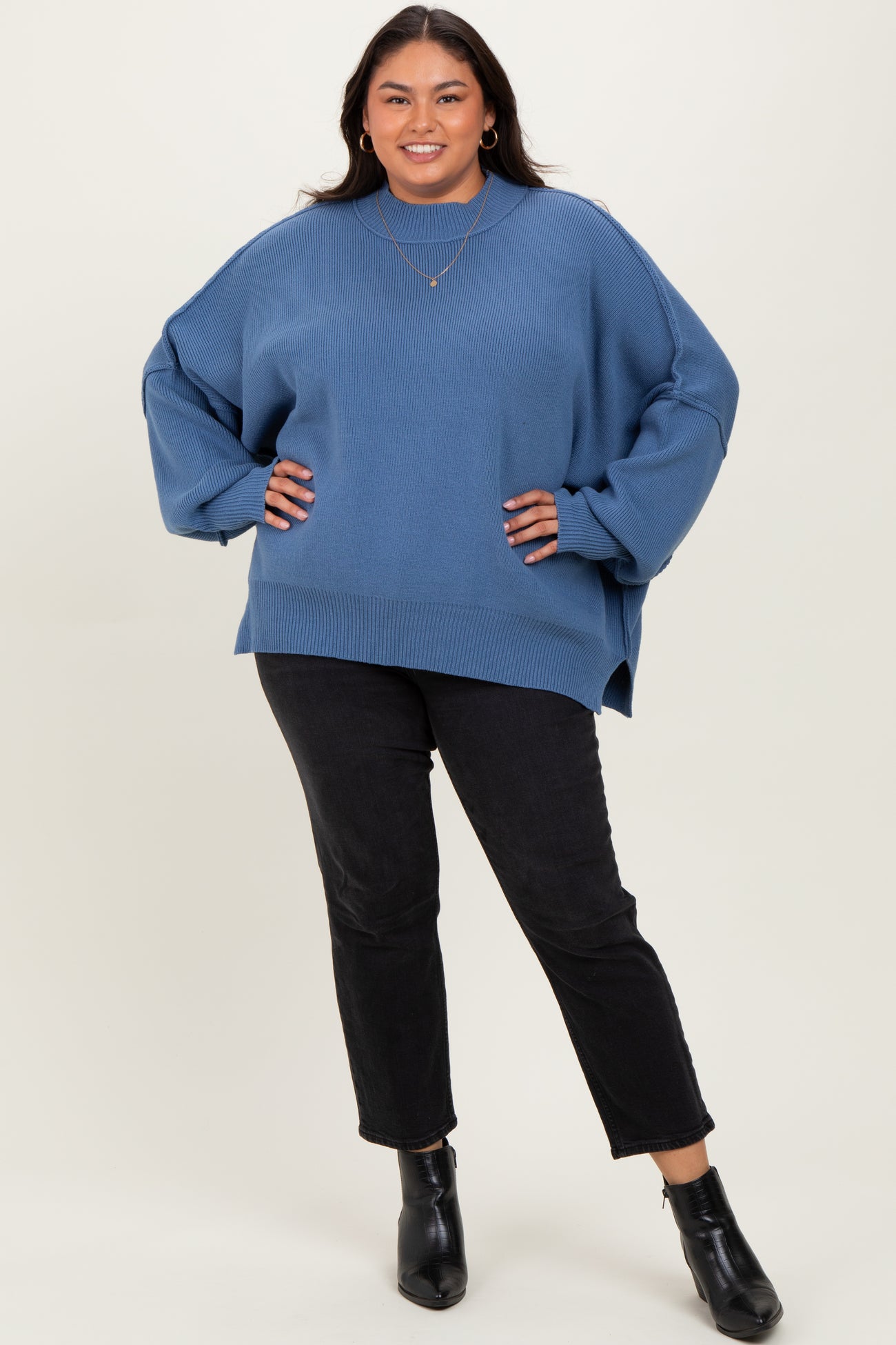 Blue Mock Neck Exposed Seam Sweater