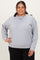 woman wearing a light gray plus-size sweatshirt with a relaxed fit and long sleeves