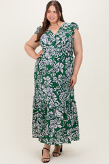 woman in a green and white floral patterned maternity dress with ruffled sleeves and a maxi length
