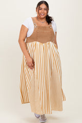 woman wearing a beige and white striped plus-size maxi dress with a corduroy top and a loose, flowing skirt