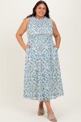 woman wearing a sleeveless floral plus-size maxi dress with pockets and a high neckline