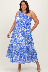 woman wearing a blue and white floral print plus size maxi dress with one shoulder and pockets