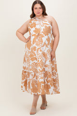 woman wearing a white and orange floral print maxi dress in maternity plus size