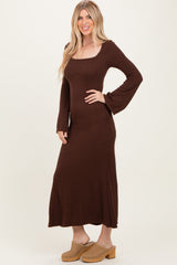 woman wearing a brown long sleeve ribbed maxi dress and beige platform clogs