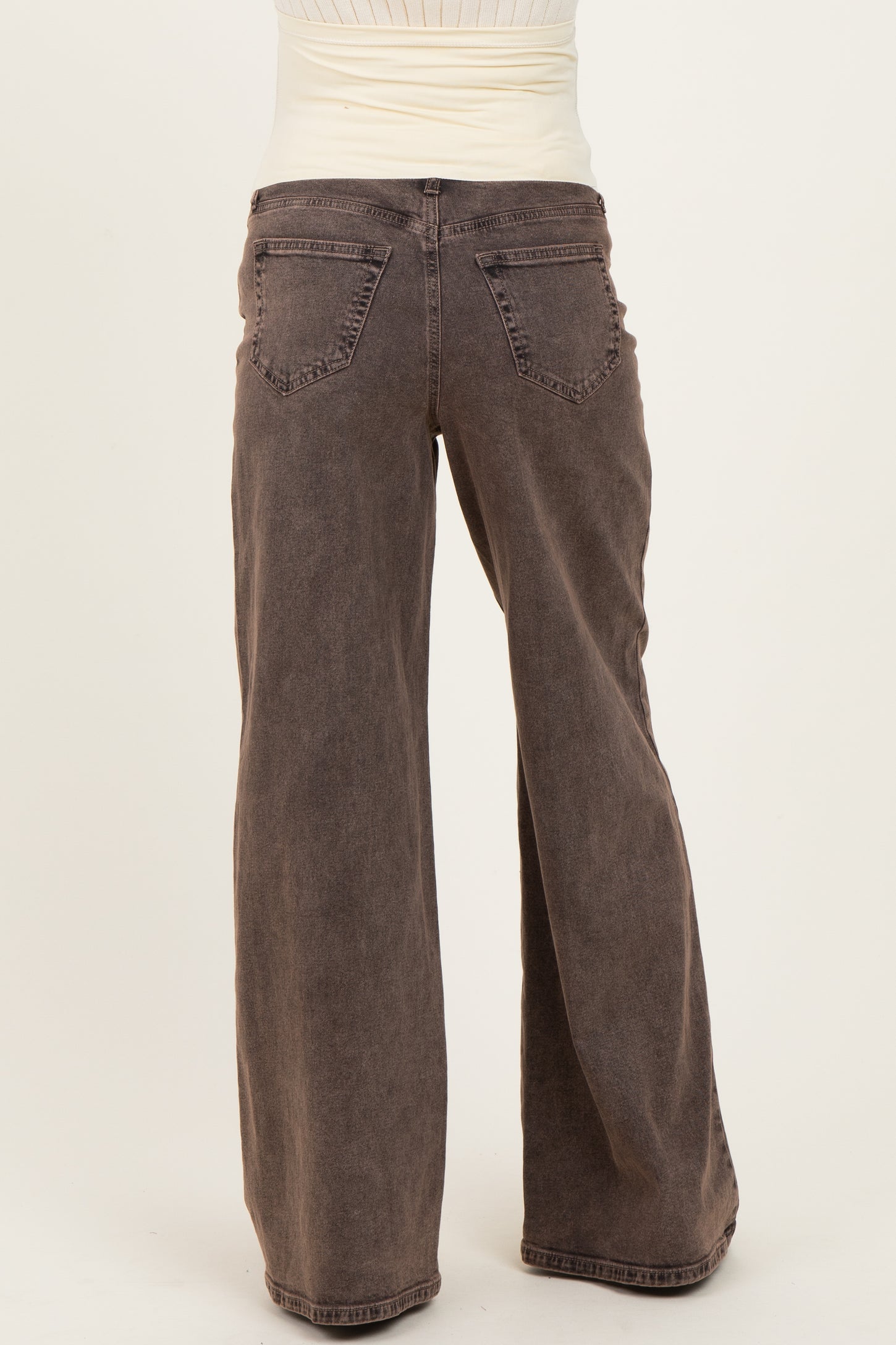 woman wearing brown wide leg maternity jeans viewed from the back