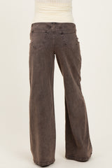 woman wearing brown wide leg maternity jeans viewed from the back