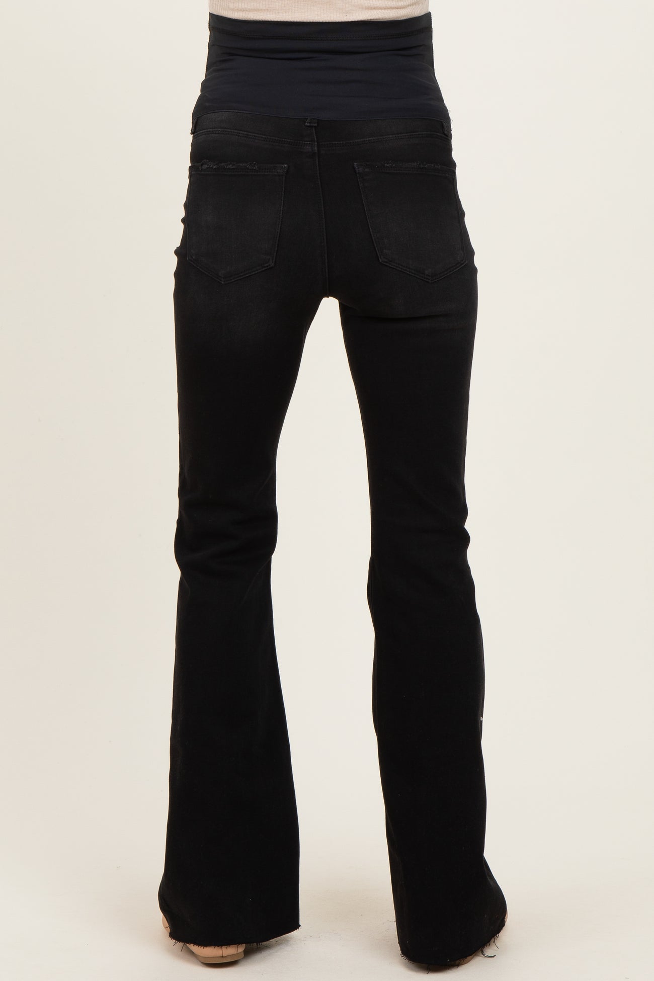 black maternity flared jeans featuring a stretchy waistband for comfort and support