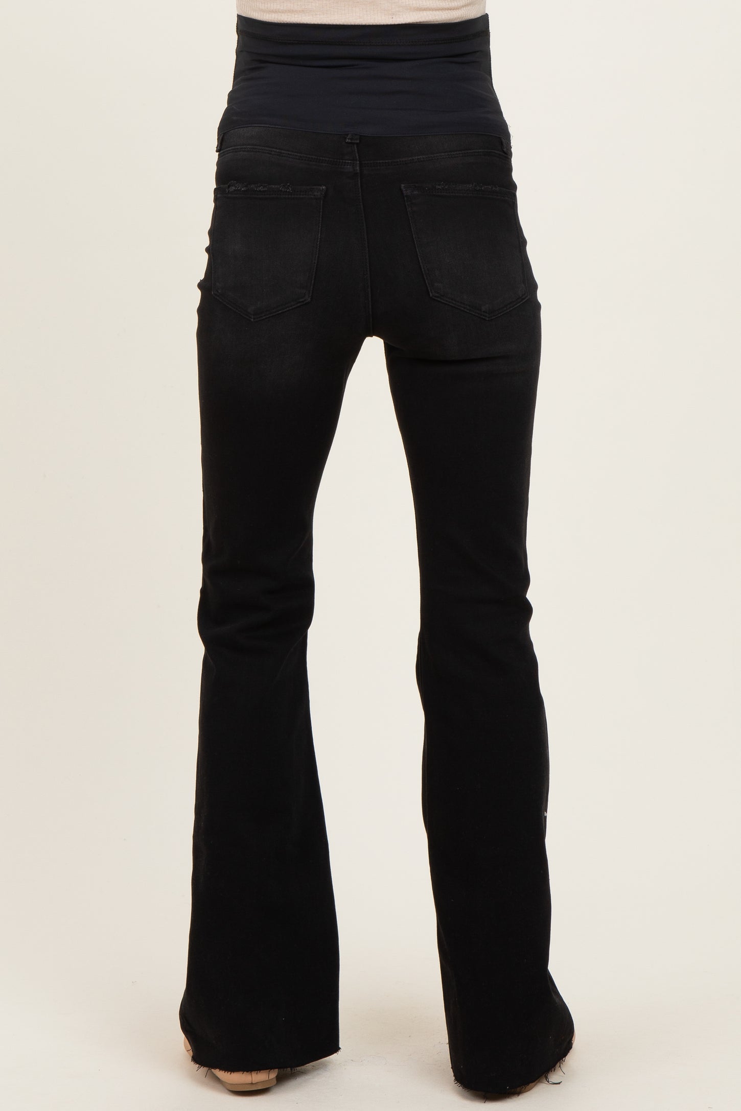 black maternity flared jeans featuring a stretchy waistband for comfort and support