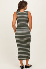 woman wearing a green and white striped maternity midi dress, shown from the back
