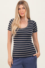 woman wearing a navy and cream striped short sleeve top with a scoop neckline and relaxed fit