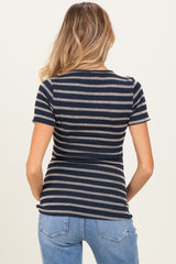 woman wearing a navy and cream striped short sleeve maternity top, viewed from the back
