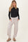 woman wearing a black long sleeve maternity top and light grey ribbed maternity pants with pockets