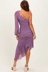 woman wearing a purple one-shoulder ruched dress with a ruffled hem and long sleeve detail