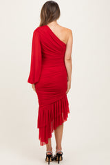 woman wearing a red one-shoulder maternity dress with ruffle details and a fitted silhouette