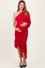 woman wearing a red one-shoulder maternity dress with ruching and a ruffled hem, holding her baby bump
