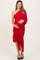 woman wearing a red one-shoulder maternity dress with ruching and a ruffled hem, holding her baby bump