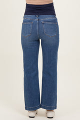 woman wearing dark blue maternity wide-leg jeans, showing an elastic waistband and back pockets