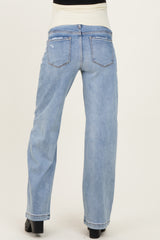woman wearing light blue maternity jeans with a wide leg and elastic waistband, showing the back view