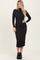 woman wearing a black long sleeve ribbed midi dress and black heeled ankle boots