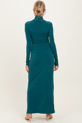 woman wearing a long sleeve teal maternity maxi dress from the back