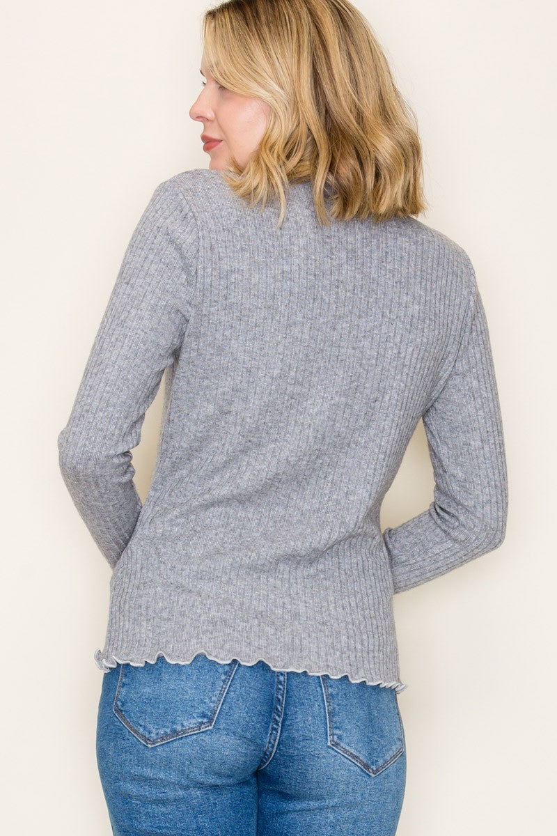 woman wearing a gray ribbed long sleeve sweater with a scalloped hem and back view displayed