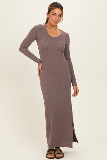 woman wearing a long sleeve brown ribbed maxi dress with side slit and a scoop neckline