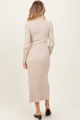 woman wearing a ribbed beige maternity maxi dress with long sleeves, showing the back view