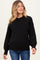 woman wearing a black maternity sweater with long sleeves and a relaxed fit, showing her baby bump