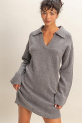 woman wearing a gray knit sweater dress with a collar and long sleeves