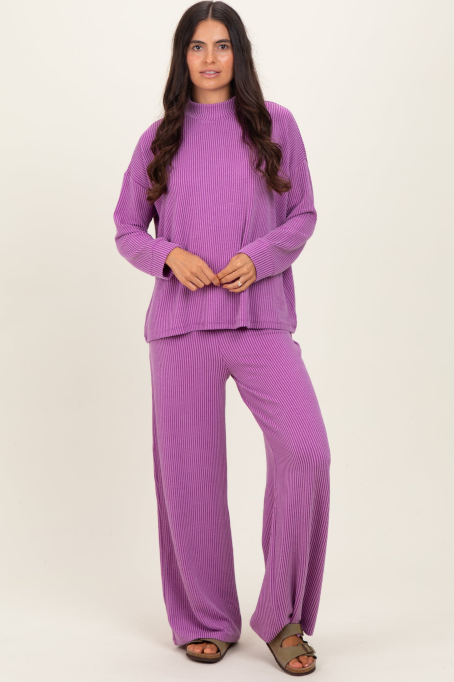 woman wearing a purple ribbed knit long sleeve top and matching wide-leg pants