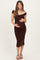woman wearing a chocolate brown off-the-shoulder ruched maternity dress and holding her baby bump