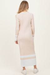 woman wearing a long sleeve pink and white striped maternity dress, shown from the back
