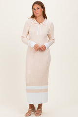 woman wearing a beige ribbed long sleeve maxi dress with white stripe details and a collared neckline