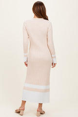 woman wearing a ribbed beige long sleeve midi dress with white stripes at the hem
