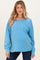 woman wearing a light blue maternity long sleeve top with a front pocket and a subtle relaxed fit