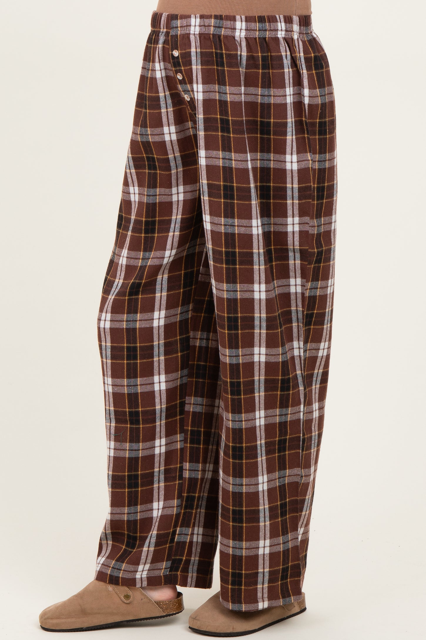 woman wearing brown plaid maternity pants with a relaxed fit and an elastic waistband