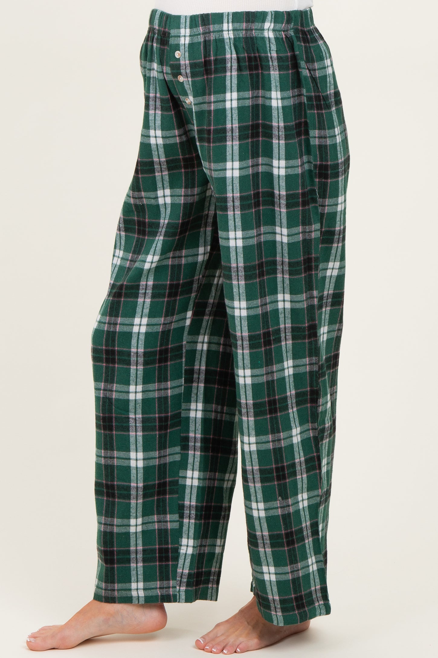maternity wear green and black plaid pajama pants with an elastic waistband, side view