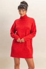 woman wearing a red oversized turtleneck sweater dress with long sleeves