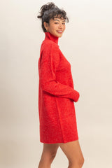woman wearing a red oversized turtleneck sweater dress with long sleeves and a relaxed fit