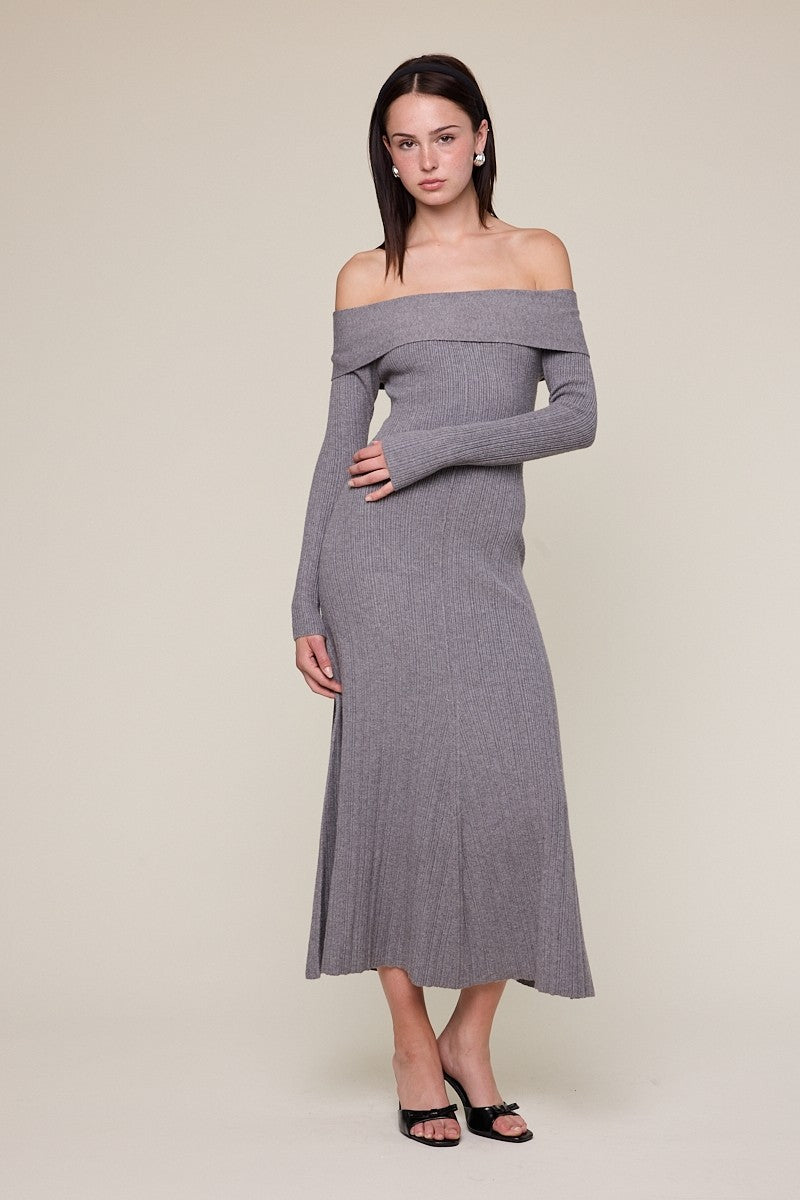 woman wearing a grey ribbed off-the-shoulder long sleeve maxi dress on a neutral background