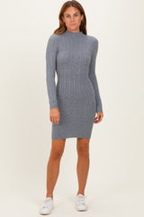 woman wearing a gray ribbed long sleeve sweater dress paired with white sneakers
