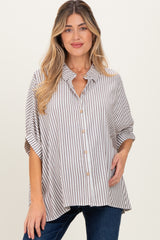 woman wearing a beige and white striped maternity shirt with a button-down front and short sleeves