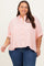 woman wearing a coral and white striped plus size button-up shirt with a relaxed fit and rolled sleeves