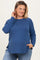 woman wearing a dark blue maternity wear long sleeve top with side slits and a baby bump visible