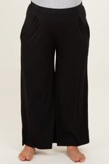 maternity plus black wide leg pants with side pockets, model wearing them barefoot