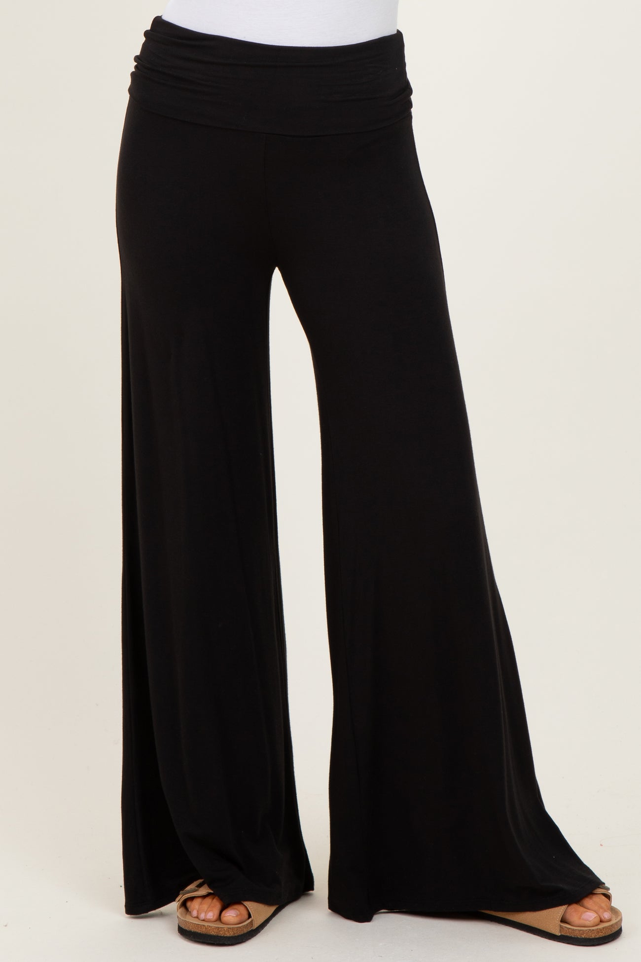 woman wearing black wide leg palazzo pants with a comfortable elastic waistband