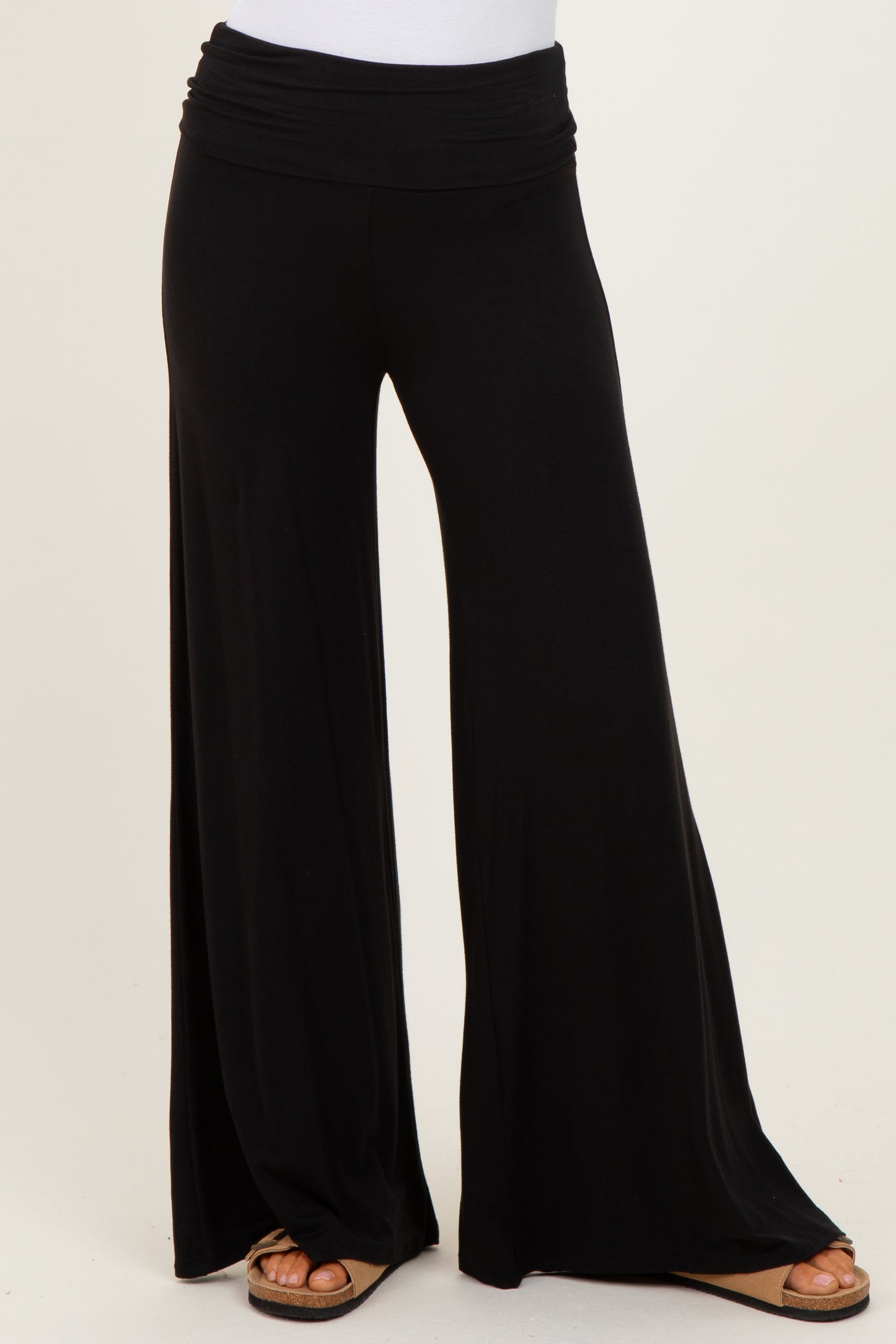 woman wearing black wide leg palazzo pants with a comfortable elastic waistband