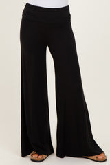 woman wearing black wide leg palazzo pants with a comfortable elastic waistband