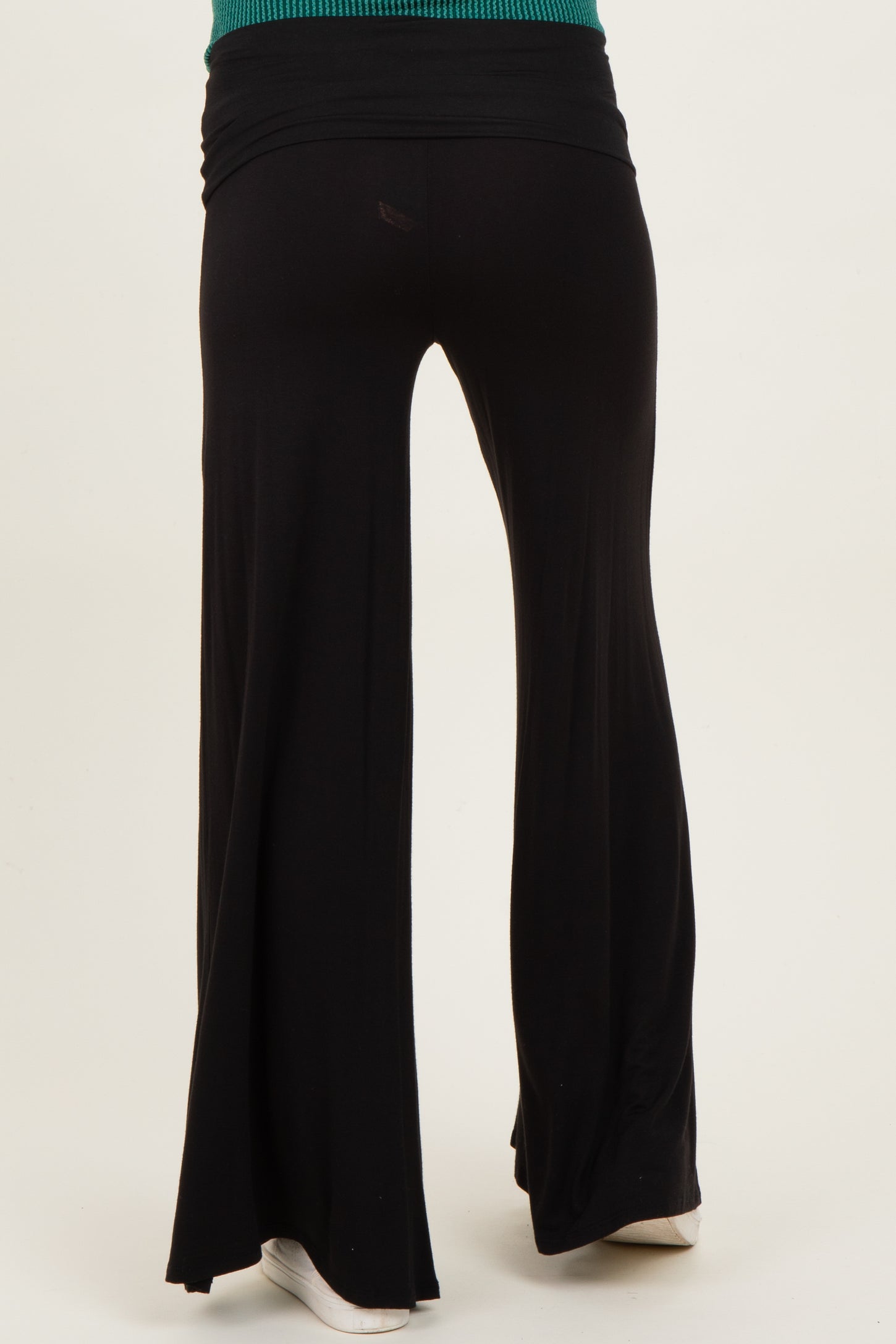 woman wearing black maternity wide-leg pants with a comfortable waistband, viewed from the back