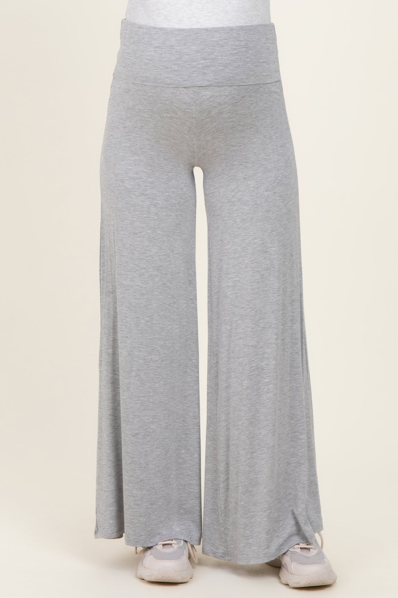 maternity wear in light grey wide-leg lounge pants with a comfortable waistband, model is wearing them